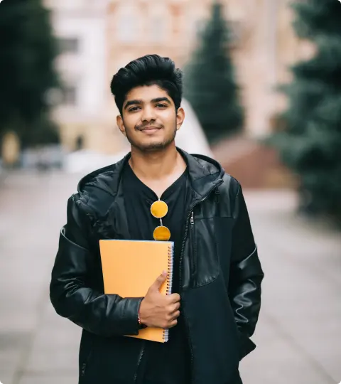 a happy Getvidya student with a book